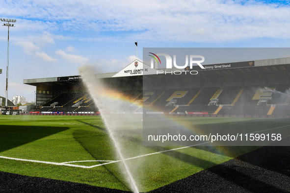 A rainbow forms as the sprinklers spray water on the pitch during the Sky Bet League 2 match between Notts County and Gillingham at Meadow L...