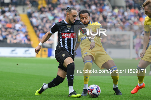 Jodi Jones of Notts County battles with Jayden Clarke of Gillingham during the Sky Bet League 2 match between Notts County and Gillingham at...