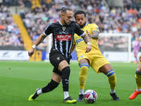 Jodi Jones of Notts County battles with Jayden Clarke of Gillingham during the Sky Bet League 2 match between Notts County and Gillingham at...