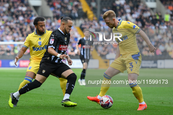 Jodi Jones of Notts County battles with Max Clark of Gillingham during the Sky Bet League 2 match between Notts County and Gillingham at Mea...