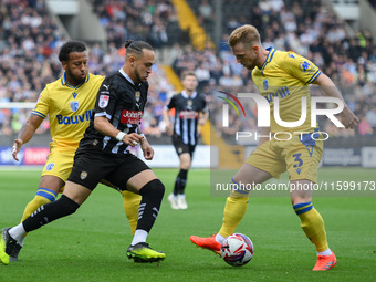 Jodi Jones of Notts County battles with Max Clark of Gillingham during the Sky Bet League 2 match between Notts County and Gillingham at Mea...