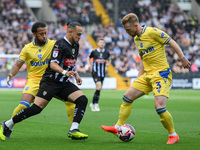 Jodi Jones of Notts County battles with Max Clark of Gillingham during the Sky Bet League 2 match between Notts County and Gillingham at Mea...