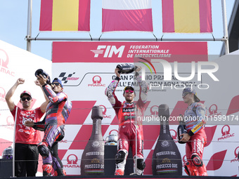 Jorge Martin of Spain and Prima Pramac Racing (L), Enea Bastianini of Italy and Ducati Lenovo Team (C), and Marc Marquez of Spain and Gresin...