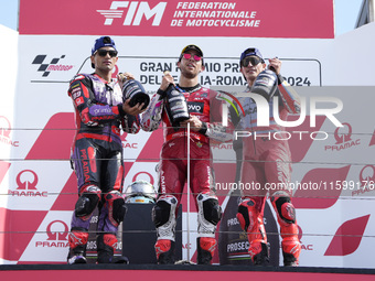 Jorge Martin of Spain and Prima Pramac Racing (L), Enea Bastianini of Italy and Ducati Lenovo Team (C), and Marc Marquez of Spain and Gresin...