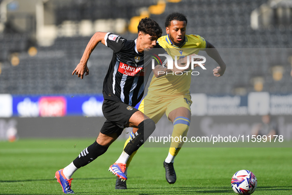 George Abbott of Notts County battles with Jayden Clarke of Gillingham during the Sky Bet League 2 match between Notts County and Gillingham...