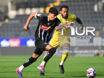 George Abbott of Notts County battles with Jayden Clarke of Gillingham during the Sky Bet League 2 match between Notts County and Gillingham...