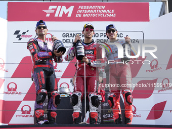 Jorge Martin of Spain and Prima Pramac Racing (L), Enea Bastianini of Italy and Ducati Lenovo Team (C), and Marc Marquez of Spain and Gresin...