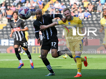 David McGoldrick of Notts County battles with Max Clark of Gillingham during the Sky Bet League 2 match between Notts County and Gillingham...