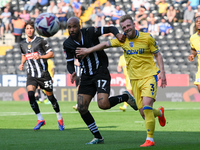 David McGoldrick of Notts County battles with Max Clark of Gillingham during the Sky Bet League 2 match between Notts County and Gillingham...