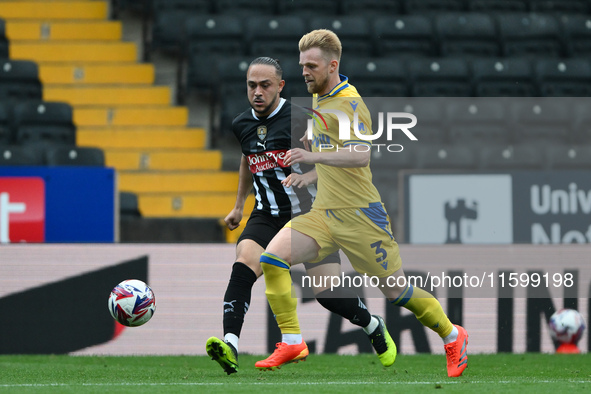 Max Clark of Gillingham is under pressure from Jodi Jones of Notts County during the Sky Bet League 2 match between Notts County and Gilling...