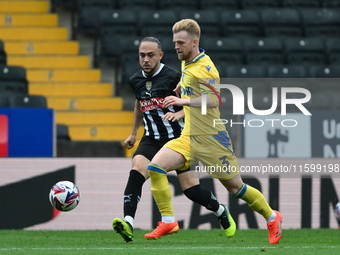 Max Clark of Gillingham is under pressure from Jodi Jones of Notts County during the Sky Bet League 2 match between Notts County and Gilling...