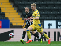 Max Clark of Gillingham is under pressure from Jodi Jones of Notts County during the Sky Bet League 2 match between Notts County and Gilling...