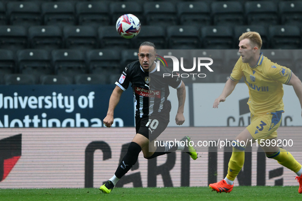 Jodi Jones of Notts County is under pressure from Max Clark of Gillingham during the Sky Bet League 2 match between Notts County and Gilling...