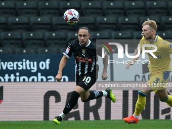 Jodi Jones of Notts County is under pressure from Max Clark of Gillingham during the Sky Bet League 2 match between Notts County and Gilling...