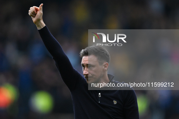 Stuart Maynard, manager of Notts County, gestures towards the County supporters during the Sky Bet League 2 match between Notts County and G...