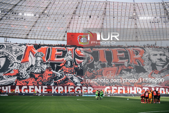 A general view inside the stadium as the fans display a tifo in the stand prior to the Bundesliga match between Bayer 04 Leverkusen and VfL...