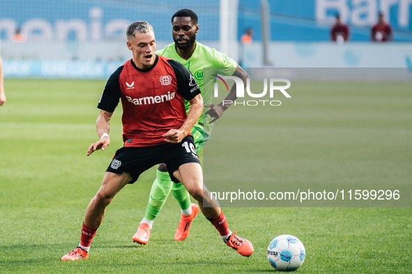 Florian Wirtz of Bayer 04 Leverkusen is in action during the Bundesliga match between Bayer 04 Leverkusen and VfL Wolfsburg at Bay Arena in...