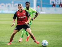 Florian Wirtz of Bayer 04 Leverkusen is in action during the Bundesliga match between Bayer 04 Leverkusen and VfL Wolfsburg at Bay Arena in...