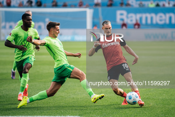 Florian Wirtz of Bayer 04 Leverkusen is in action during the Bundesliga match between Bayer 04 Leverkusen and VfL Wolfsburg at Bay Arena in...