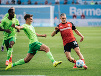 Florian Wirtz of Bayer 04 Leverkusen is in action during the Bundesliga match between Bayer 04 Leverkusen and VfL Wolfsburg at Bay Arena in...