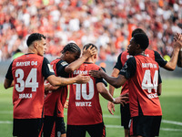 Florian Wirtz of Bayer 04 Leverkusen celebrates his goal with teammates during the Bundesliga match between Bayer 04 Leverkusen and VfL Wolf...