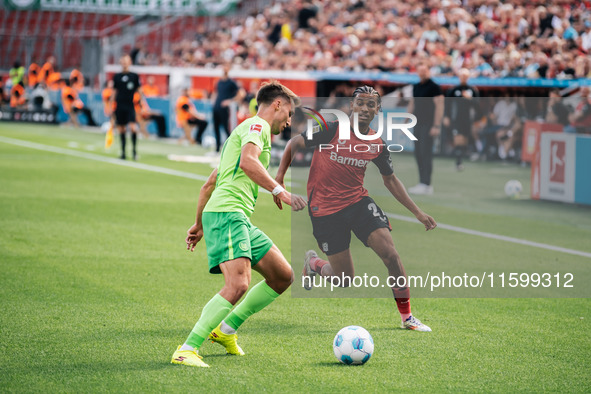 Amine Adli of Bayer 04 Leverkusen is in action during the Bundesliga match between Bayer 04 Leverkusen and VfL Wolfsburg at Bay Arena in Lev...