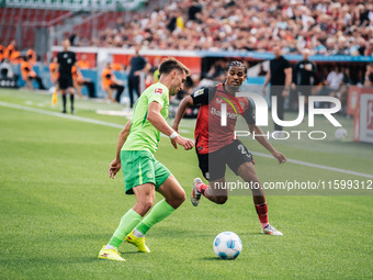 Amine Adli of Bayer 04 Leverkusen is in action during the Bundesliga match between Bayer 04 Leverkusen and VfL Wolfsburg at Bay Arena in Lev...