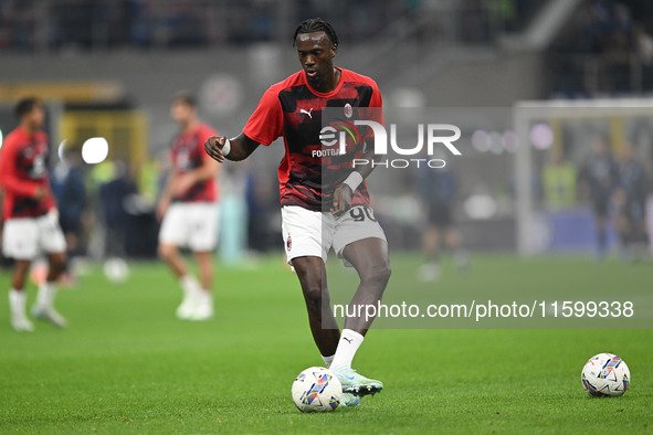 Tammy Abraham of AC Milan warms up prior to the Italian Serie A football match between Inter FC and AC Milan in Milan, Italy, on September 2...