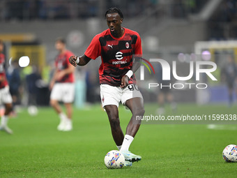 Tammy Abraham of AC Milan warms up prior to the Italian Serie A football match between Inter FC and AC Milan in Milan, Italy, on September 2...