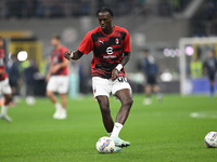 Tammy Abraham of AC Milan warms up prior to the Italian Serie A football match between Inter FC and AC Milan in Milan, Italy, on September 2...