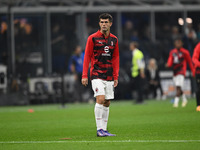 Christian Pulisic of AC Milan warms up prior to the Italian Serie A football match between Inter FC and AC Milan in Milan, Italy, on Septemb...