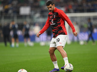 Theo Hernandez of AC Milan warms up prior to the Italian Serie A football match between Inter FC and AC Milan in Milan, Italy, on September...