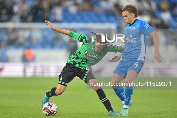 Kor Shaw (37 Bristol Rovers) is challenged by Archie Collins (4 Peterborough United) during the Sky Bet League 1 match between Peterborough...