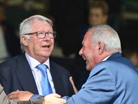 Sir Alex Ferguson converses with Barry Fry during the Sky Bet League 1 match between Peterborough and Bristol Rovers at London Road in Peter...