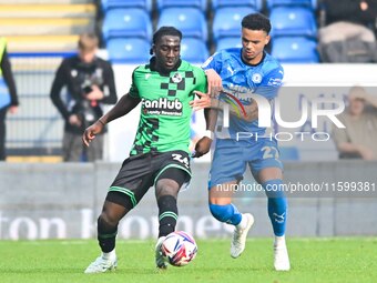 Gatlin O'Donkor (24 Bristol Rovers) and Jadel Katongo (27 Peterborough United) challenge for the ball during the Sky Bet League 1 match betw...