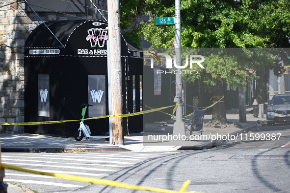 NYPD crime scene investigators search for and collect evidence at the scene outside Wave Juice Bar and Lounge where a 31-year-old man is kil...