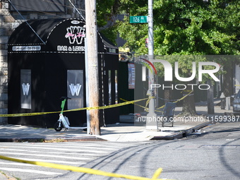 NYPD crime scene investigators search for and collect evidence at the scene outside Wave Juice Bar and Lounge where a 31-year-old man is kil...