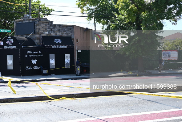 NYPD crime scene investigators search for and collect evidence at the scene outside Wave Juice Bar and Lounge where a 31-year-old man is kil...