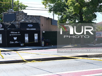 NYPD crime scene investigators search for and collect evidence at the scene outside Wave Juice Bar and Lounge where a 31-year-old man is kil...