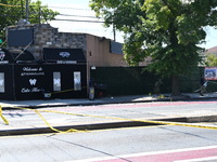 NYPD crime scene investigators search for and collect evidence at the scene outside Wave Juice Bar and Lounge where a 31-year-old man is kil...