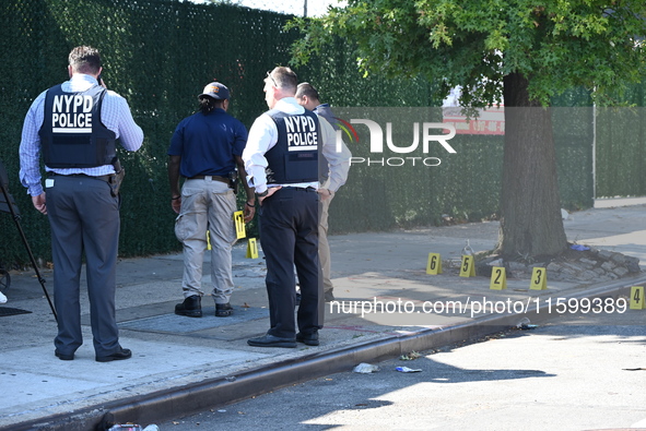 NYPD crime scene investigators search for and collect evidence at the scene outside Wave Juice Bar and Lounge where a 31-year-old man is kil...