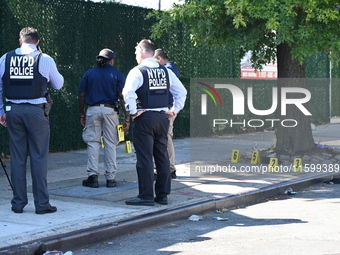 NYPD crime scene investigators search for and collect evidence at the scene outside Wave Juice Bar and Lounge where a 31-year-old man is kil...