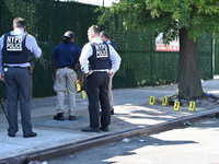 NYPD crime scene investigators search for and collect evidence at the scene outside Wave Juice Bar and Lounge where a 31-year-old man is kil...