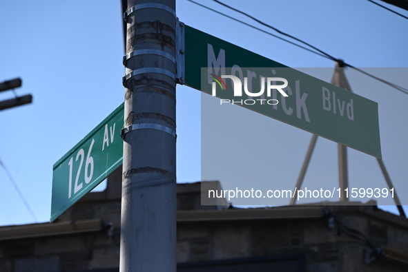 Street signage at the scene. NYPD crime scene investigators search for and collect evidence at the scene outside Wave Juice Bar and Lounge w...