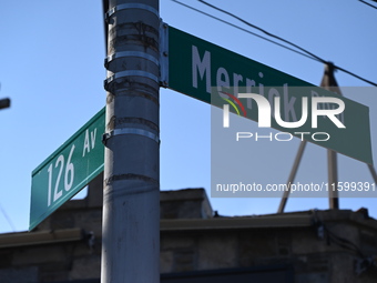 Street signage at the scene. NYPD crime scene investigators search for and collect evidence at the scene outside Wave Juice Bar and Lounge w...