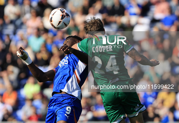 Mike Fondop of Oldham Athletic Association Football Club tussles with Charlie Cooper of Yeovil Town Football Club during the Vanarama Nation...