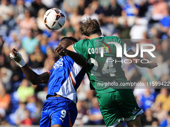 Mike Fondop of Oldham Athletic Association Football Club tussles with Charlie Cooper of Yeovil Town Football Club during the Vanarama Nation...