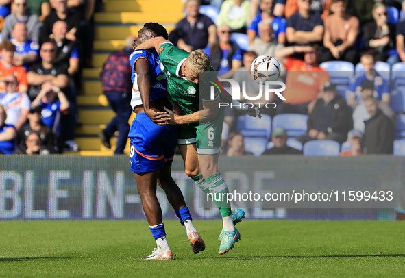 Mike Fondop of Oldham Athletic Association Football Club tussles with Jake Wannell of Yeovil Town Football Club during the Vanarama National...