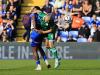 Mike Fondop of Oldham Athletic Association Football Club tussles with Jake Wannell of Yeovil Town Football Club during the Vanarama National...