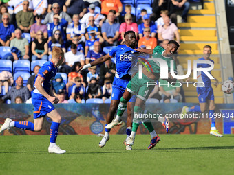 Mike Fondop of Oldham Athletic Association Football Club tussles with Morgan Williams of Yeovil Town Football Club during the Vanarama Natio...